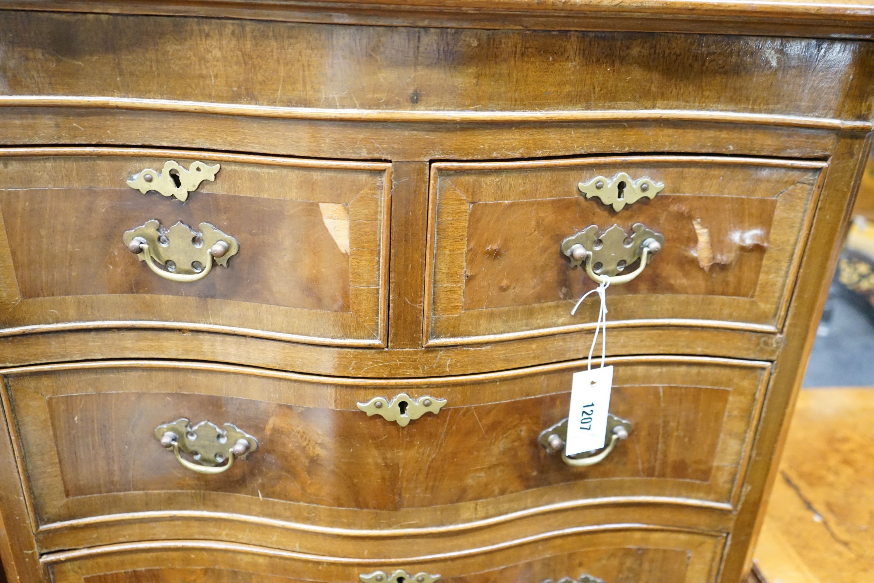 A reproduction 18th century style serpentine walnut tall chest fitted slide, width 66cm, depth 43cm, height 134cm